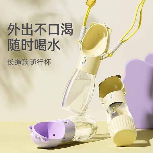 Cute outdoor dog water bottle with water and kibble chamber for hiking